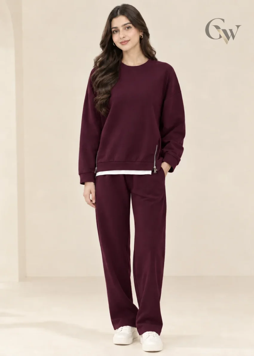 women's sweatshirt with side zippers and matching wide-leg trousers displayed as a two-piece set