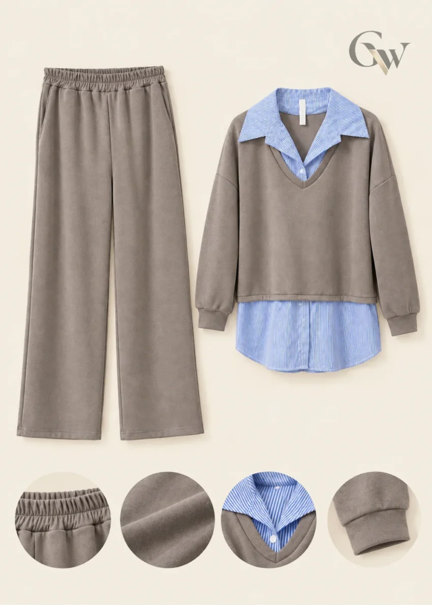 Woman wearing a taupe-grey V-neck sweatshirt and matching wide-leg trousers with a blue-and-white striped shirt