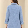 Women's blue and white patterned open-front jacket with lapel-style collar and contrasting light trim