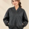Woman wearing a black Leather bomber jacket with a front zip and stand collar