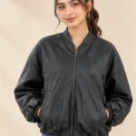 Woman wearing a black Leather bomber jacket with a front zip and stand collar