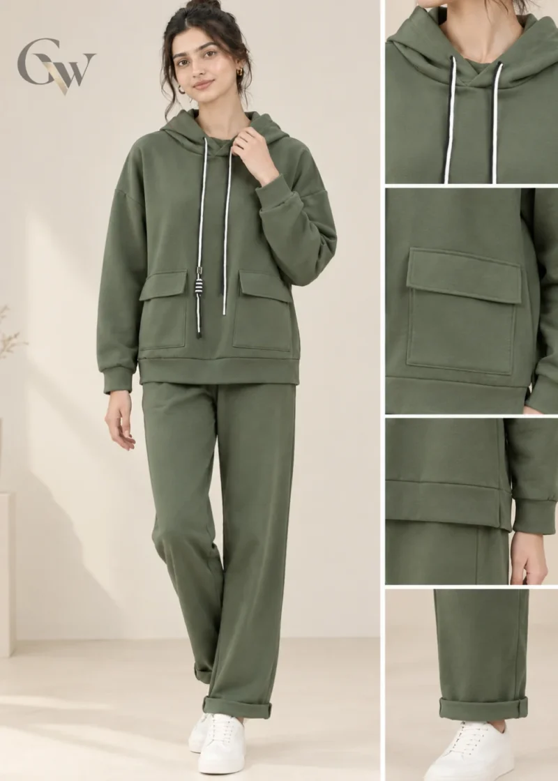 Woman wearing an olive green hooded co-ord set with white drawstrings and flap-detail pockets.